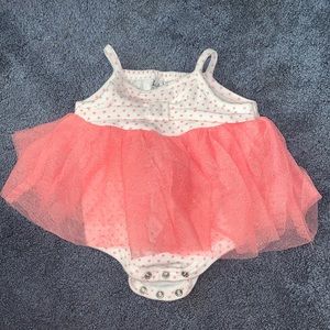 Pink and white, tulle has gold glitter. Worn once